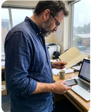 Scanning a paper document at a desk